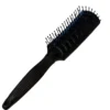 Cepillo Nomnom para desenredar el cabello suavemente, con cerdas flexibles que reducen el frizz y lo mantienen manejable.